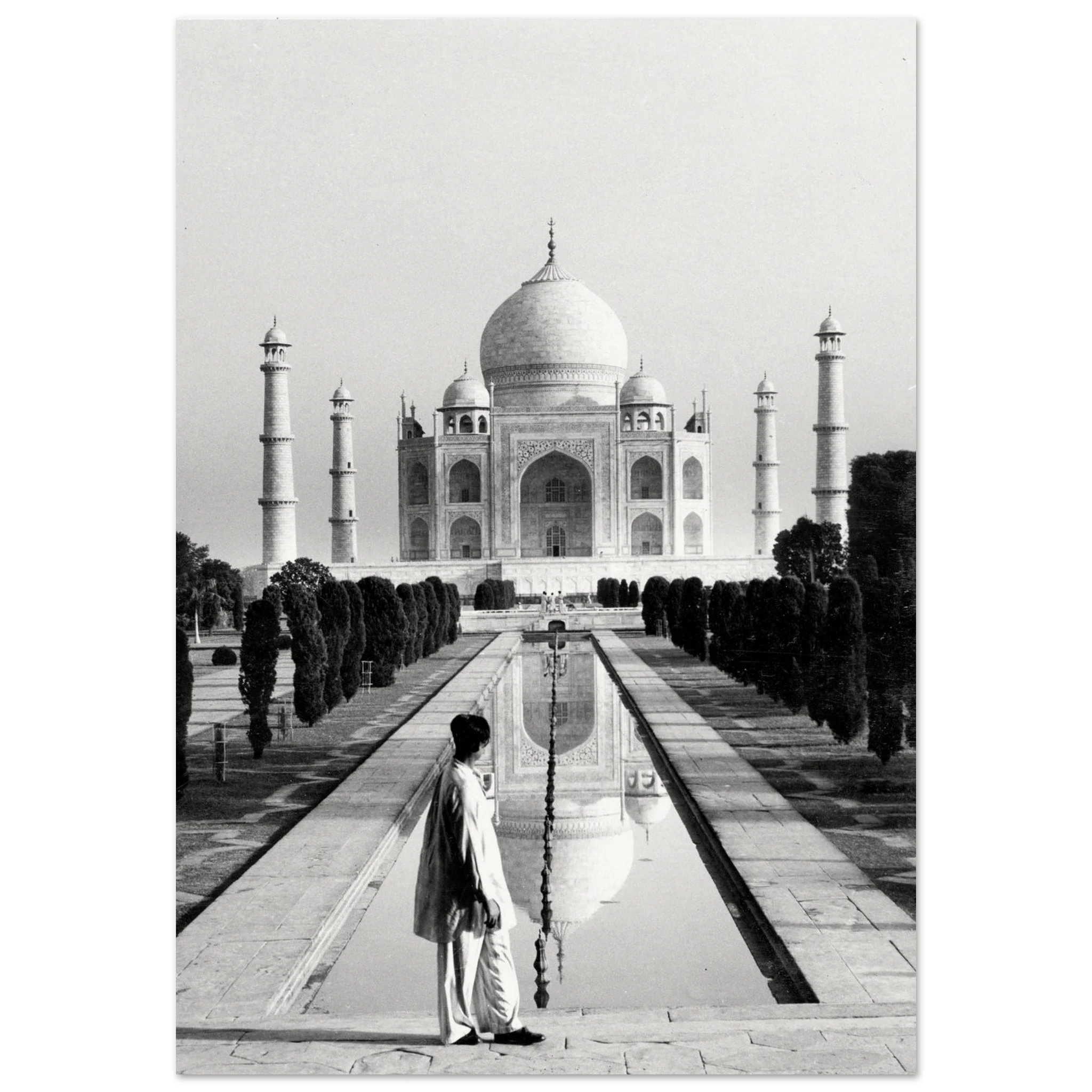 An Agra citizen in traditional attire stands before the Taj Mahal at sunrise, embodying reverence and continuity.