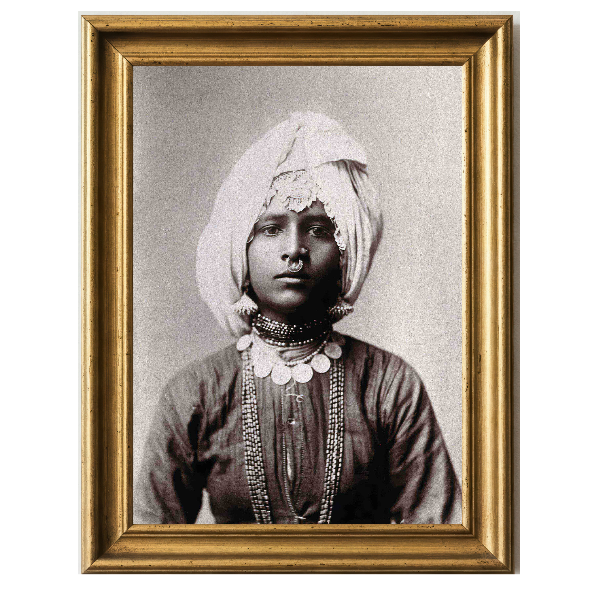 Sepia portrait of a Hindu princess wearing traditional attire and ornate jewelry, exuding regal poise.