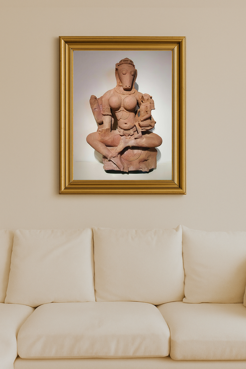 Sandstone sculpture of horse-headed Yogini Hayagriva seated cross-legged and holding a child