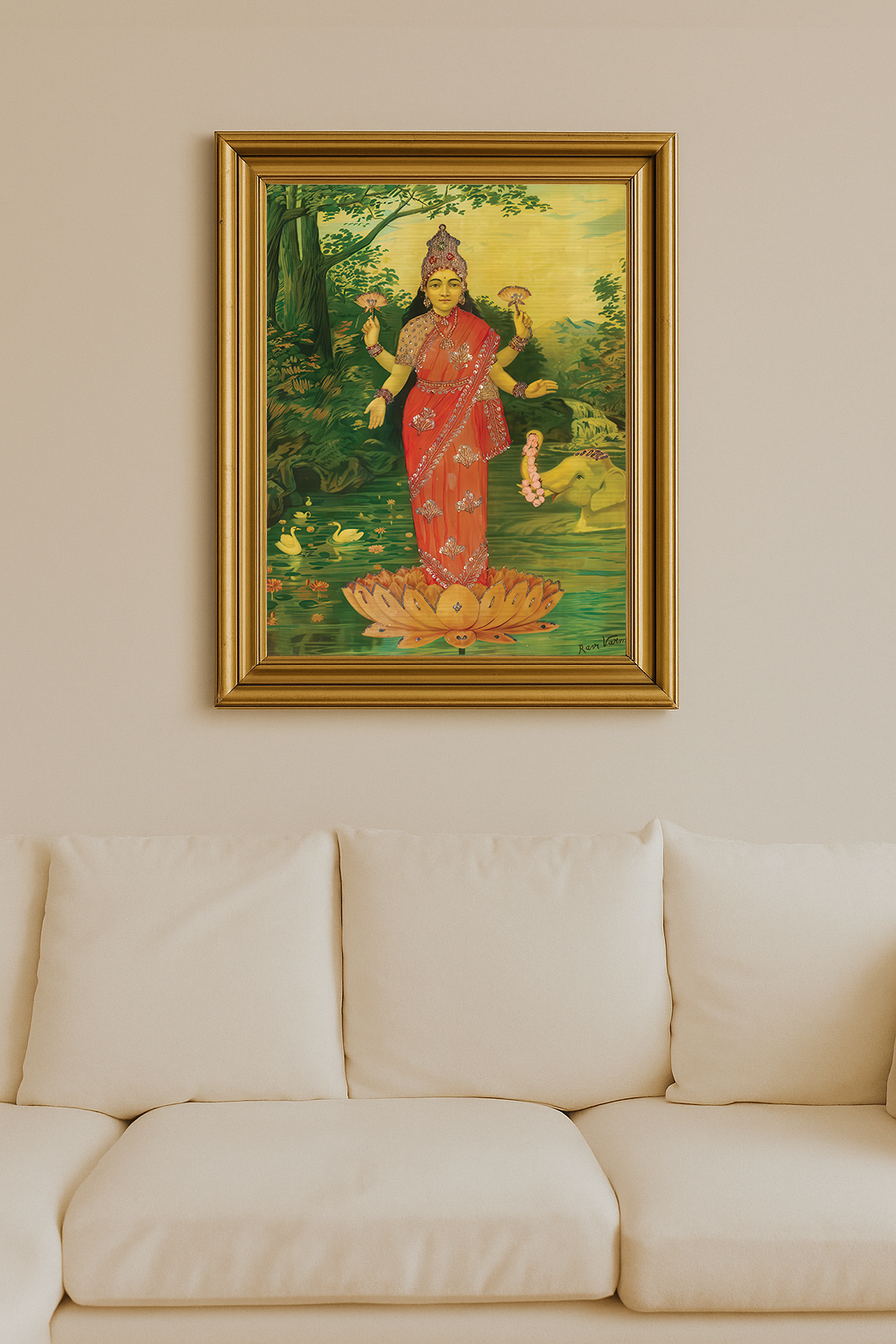 Lakshmi in embellished red sari standing on lotus with elephant offering garland
