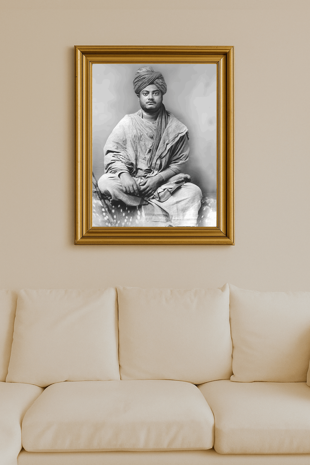Black-and-white photograph of Swami Vivekananda seated cross-legged, clad in robes and turban