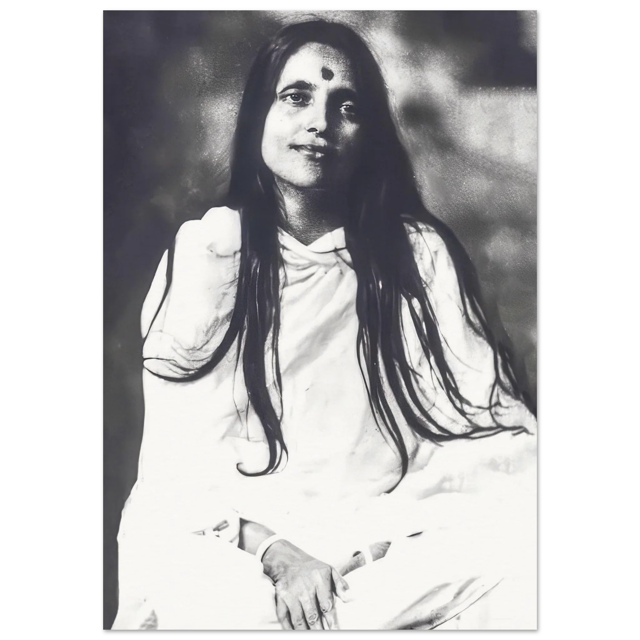 Black-and-white portrait of Sri Anandamayi Ma in white robes, serene expression and long hair