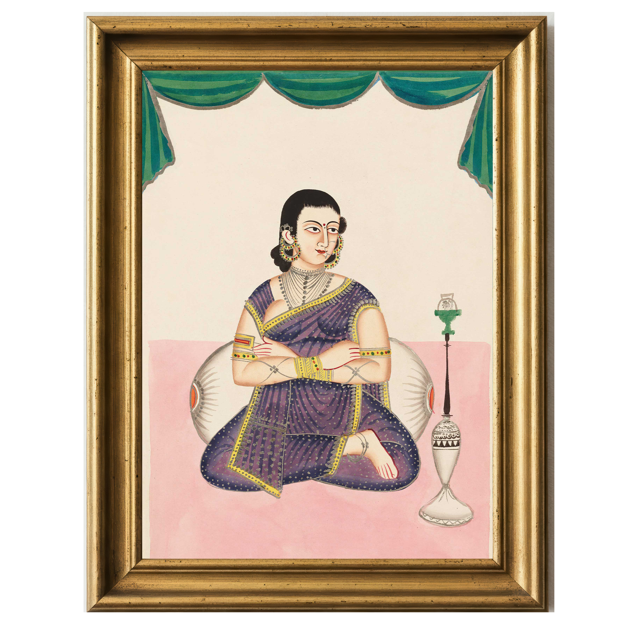 Indian woman in purple sari seated cross-legged with folded arms, adorned in jewelry, beside a traditional hookah, under ceremonial green drapery.